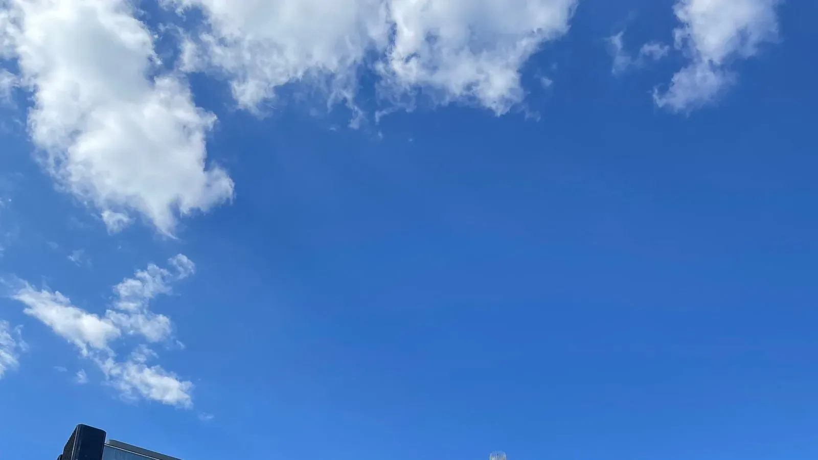 The Charlotte skyline and its uptown towers under a clear blue sky