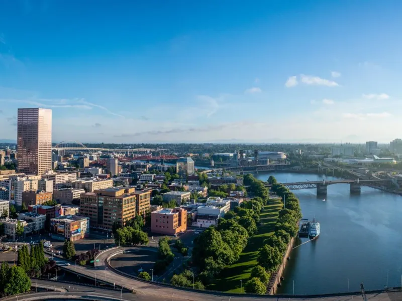 Downtown Portland from the air, the Willamette River and its bridges crossing the frame
